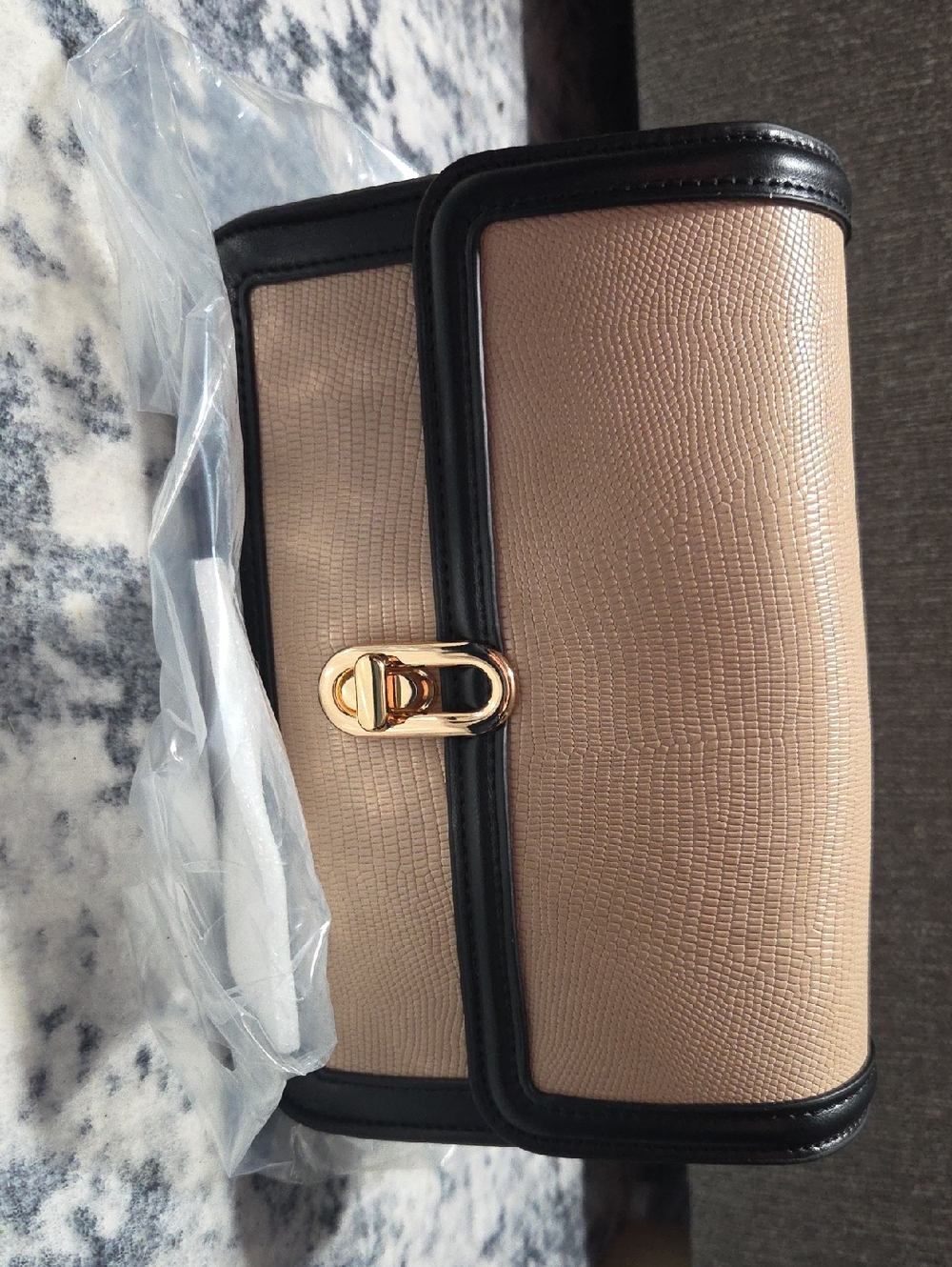 Elegant Taupe Clutch with Black Trim and Gold Turn-Lock